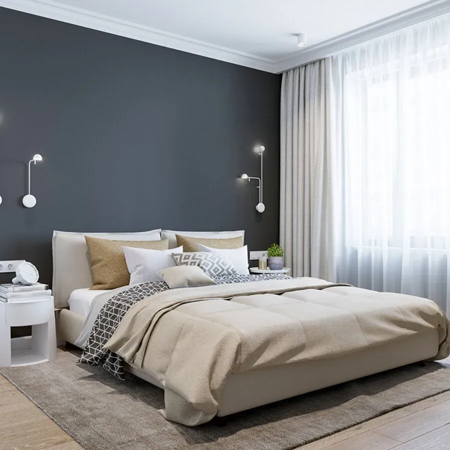 A bedroom with a large bed and a window
