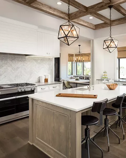 There is a large island in the middle of the kitchen.